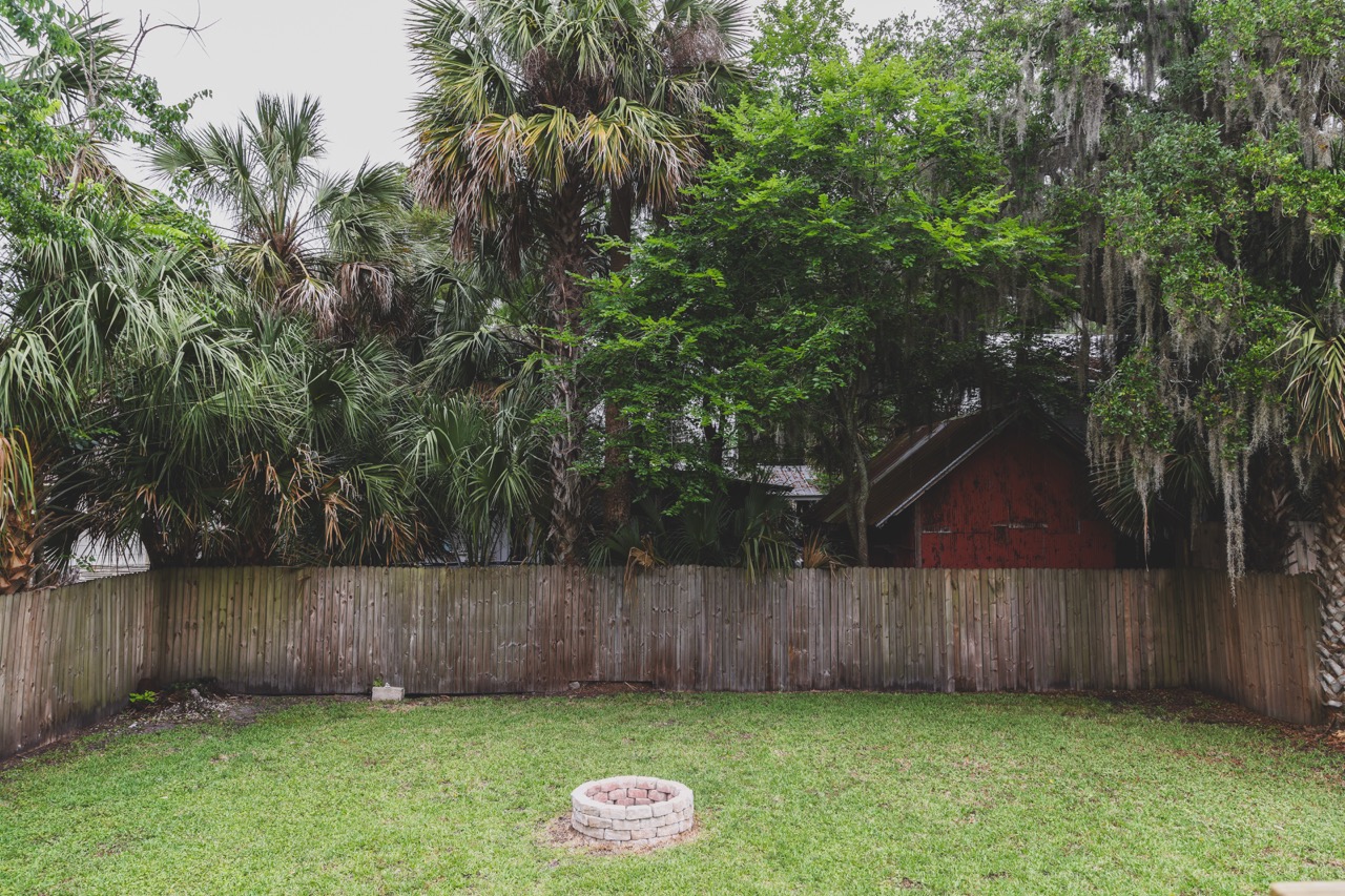 Backyard with fire pit and palms
