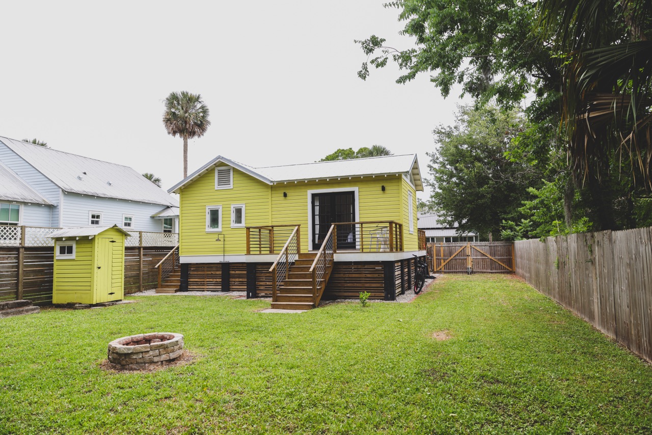 Backyard view of the cottage and deck